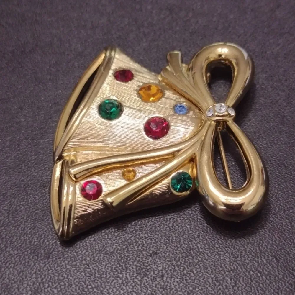 Vintage gold tone bell brooch